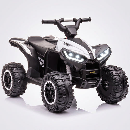 Quad électrique enfant 12V blanc et noir, phares LED allumés et grandes roues crantées, vue de trois quarts avant